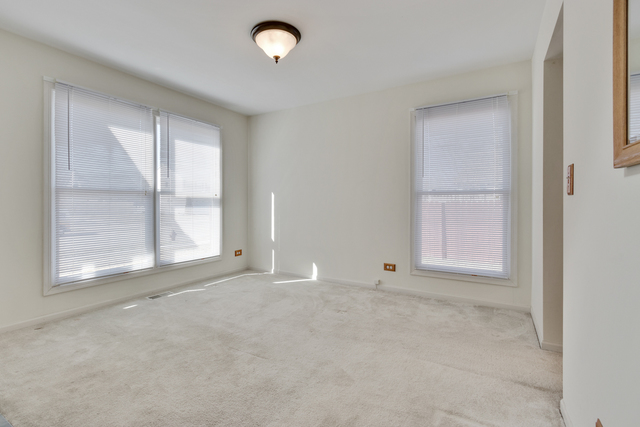 1822 Olde Mill Road Plainfield, IL 60586 - Photo 13 of 29 an empty room with windows