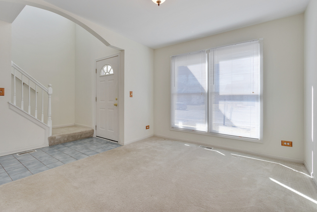1822 Olde Mill Road Plainfield, IL 60586 - Photo 14 of 29 an empty room with windows