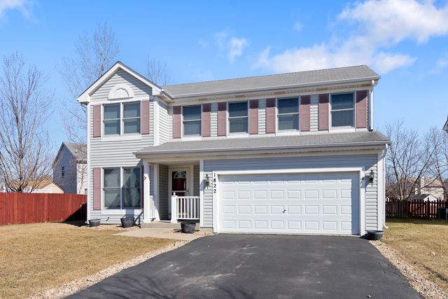 1822 Olde Mill Road Plainfield, IL 60586 - Photo 3 of 29 a front view of a house with a yard and garage