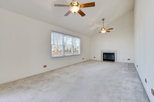 1822 Olde Mill Road Plainfield, IL 60586 - Photo 22 of 29 an empty room with windows and ceiling fan