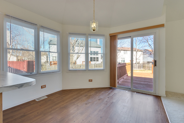 1822 Olde Mill Road Plainfield, IL 60586 - Photo 24 of 29 a view of an empty room with wooden floor and a window
