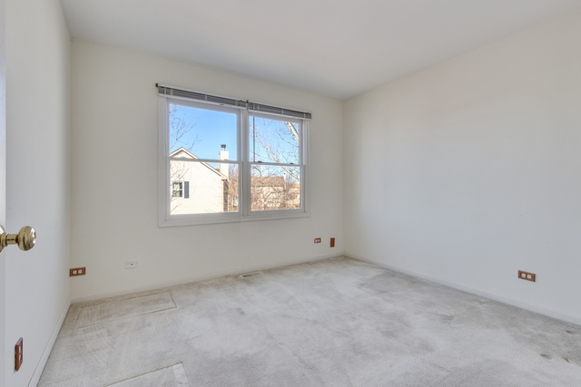 1822 Olde Mill Road Plainfield, IL 60586 - Photo 5 of 29 an empty room with a window