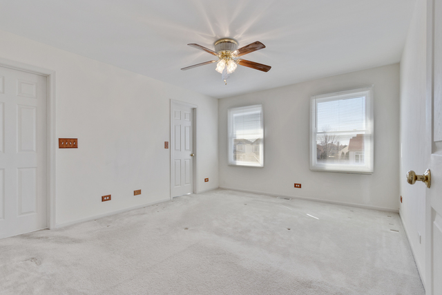 1822 Olde Mill Road Plainfield, IL 60586 - Photo 8 of 29 a view of an empty room with window