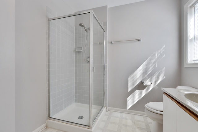 1822 Olde Mill Road Plainfield, IL 60586 - Photo 10 of 29 a bathroom with a shower a toilet and a sink