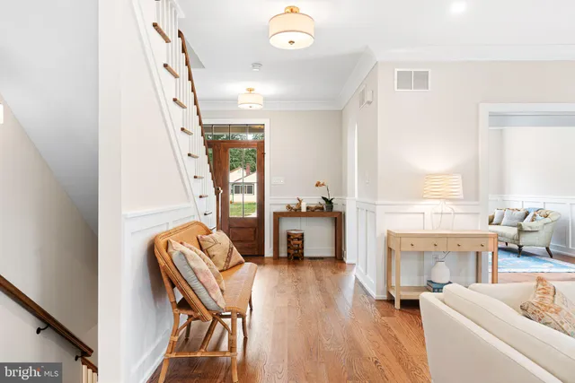 a view of entryway with wooden floor and door