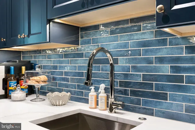 a bathroom with a sink vanity and a mirror