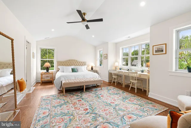 a bedroom with furniture and a wooden floor
