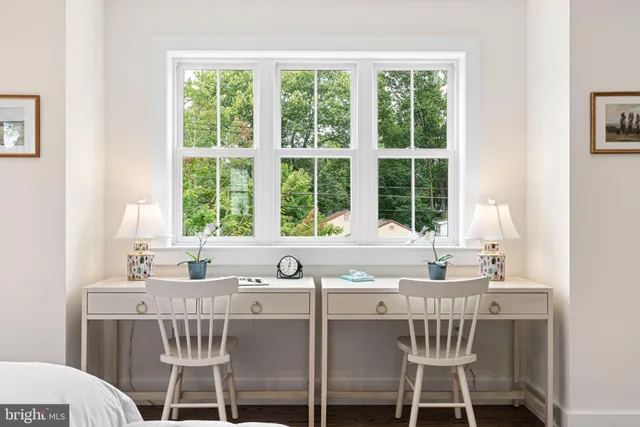 a view of a livingroom with furniture and windows