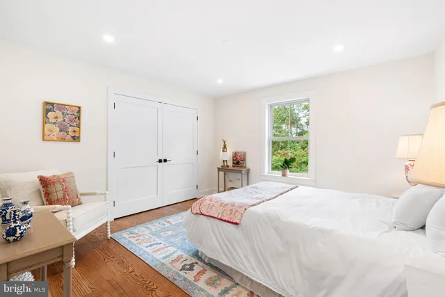 a front view of a house with outdoor seating and plants