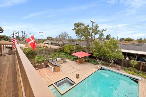 swimming pool view with a sitting space