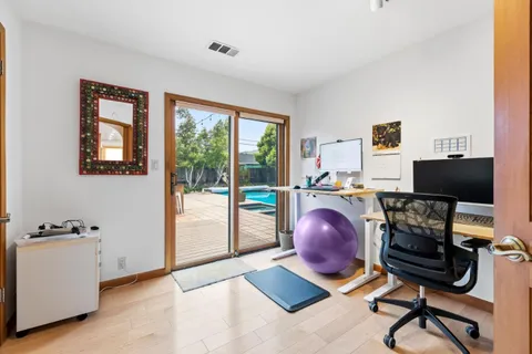 a bedroom with a bed window and couch