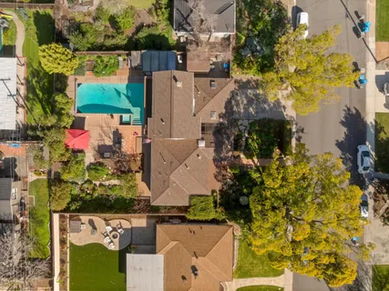 an aerial view of residential houses with outdoor space