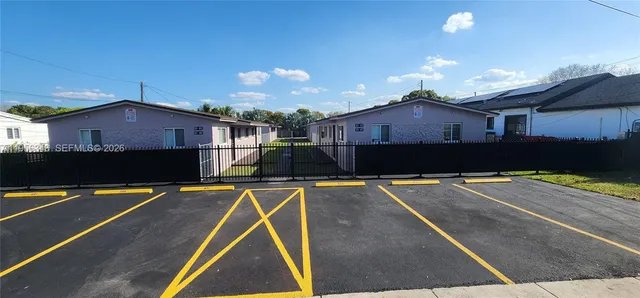 a front view of a house with swimming pool