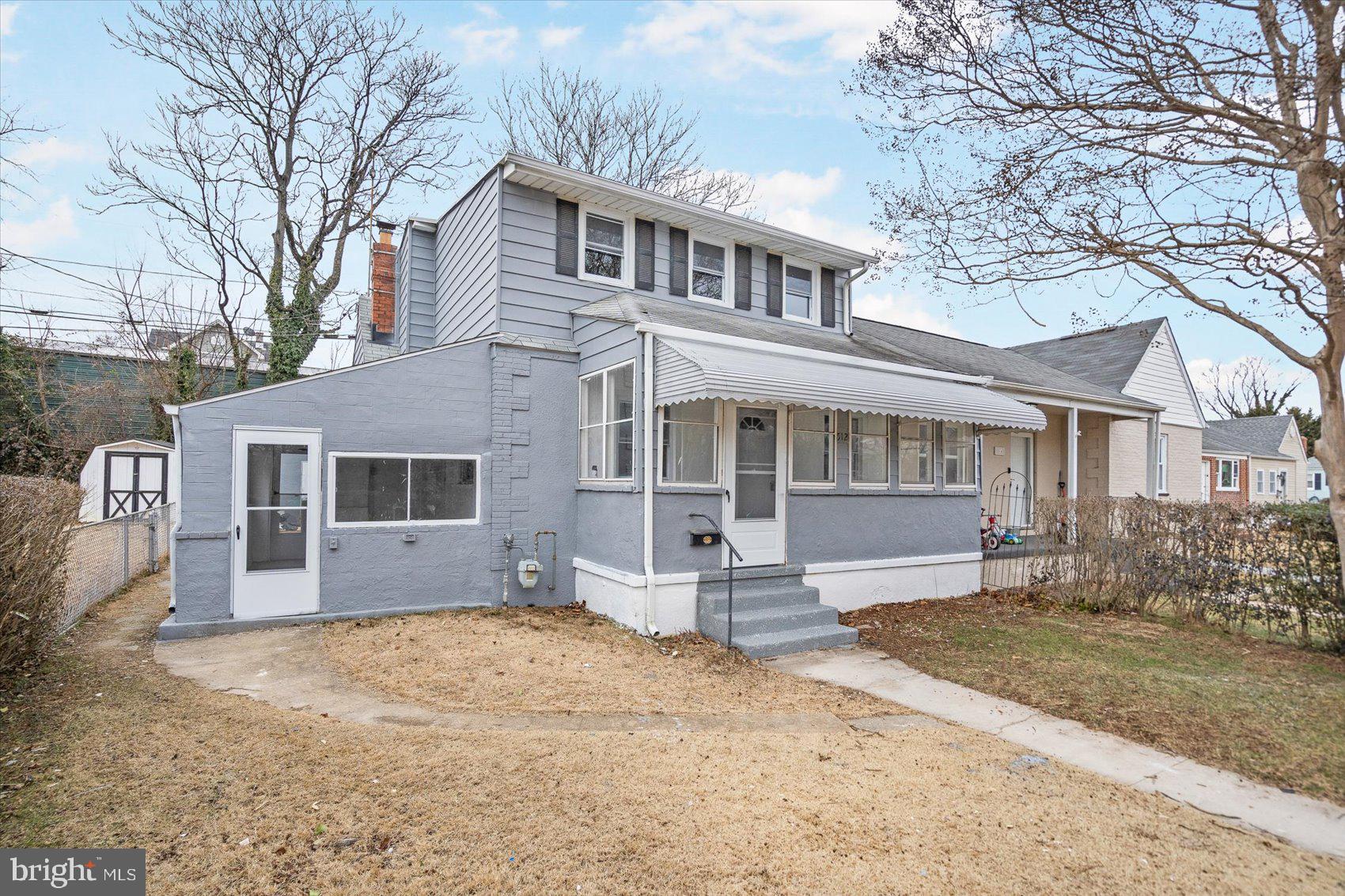 512 Meadow Road Baltimore, MD 21206 - Photo 35 of 41 a front view of a house with yard and trees