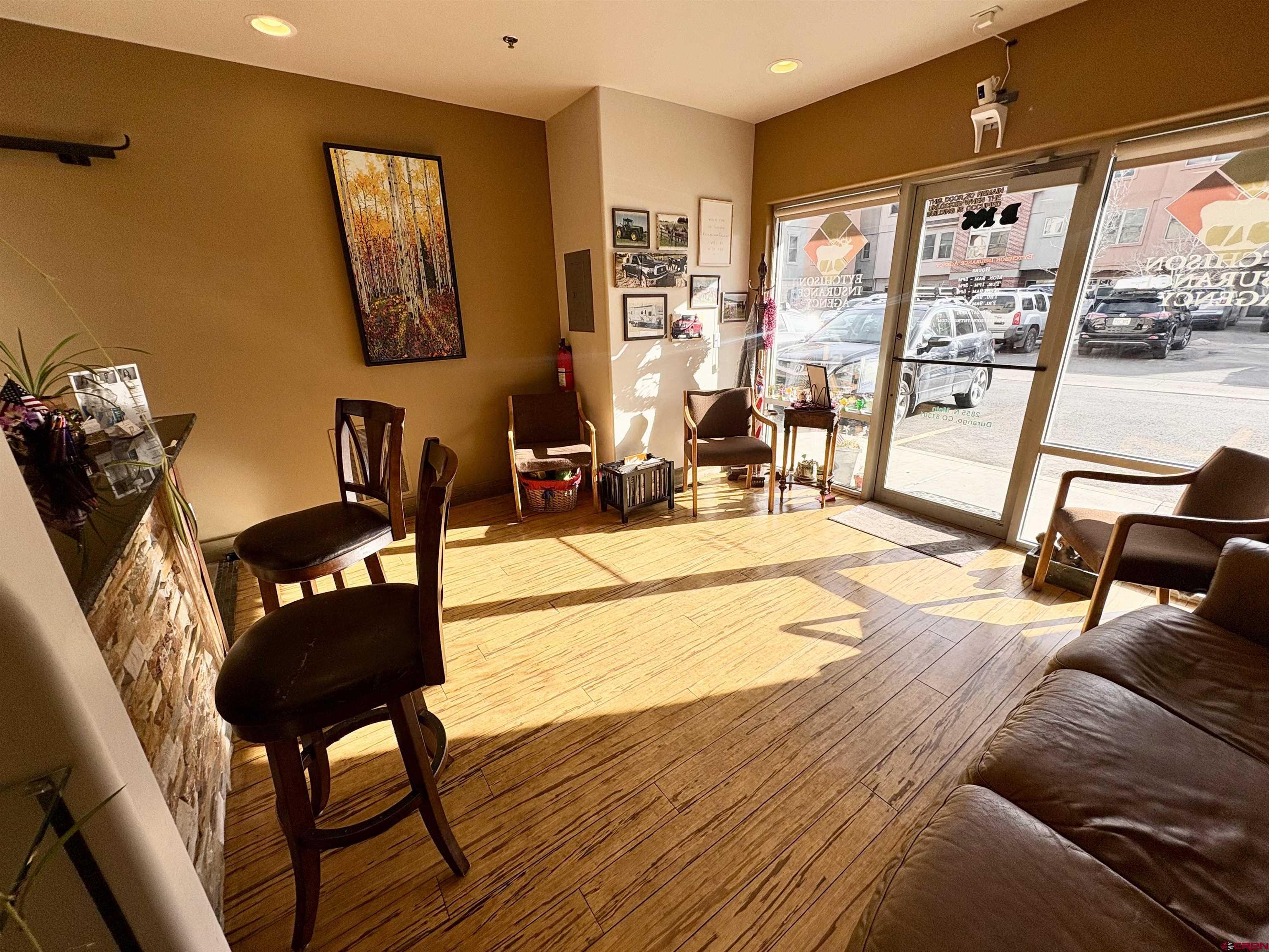 2855 Main Avenue, Unit 106B Durango, CO 81301 - Photo 11 of 18 a living room with furniture and a floor to ceiling window