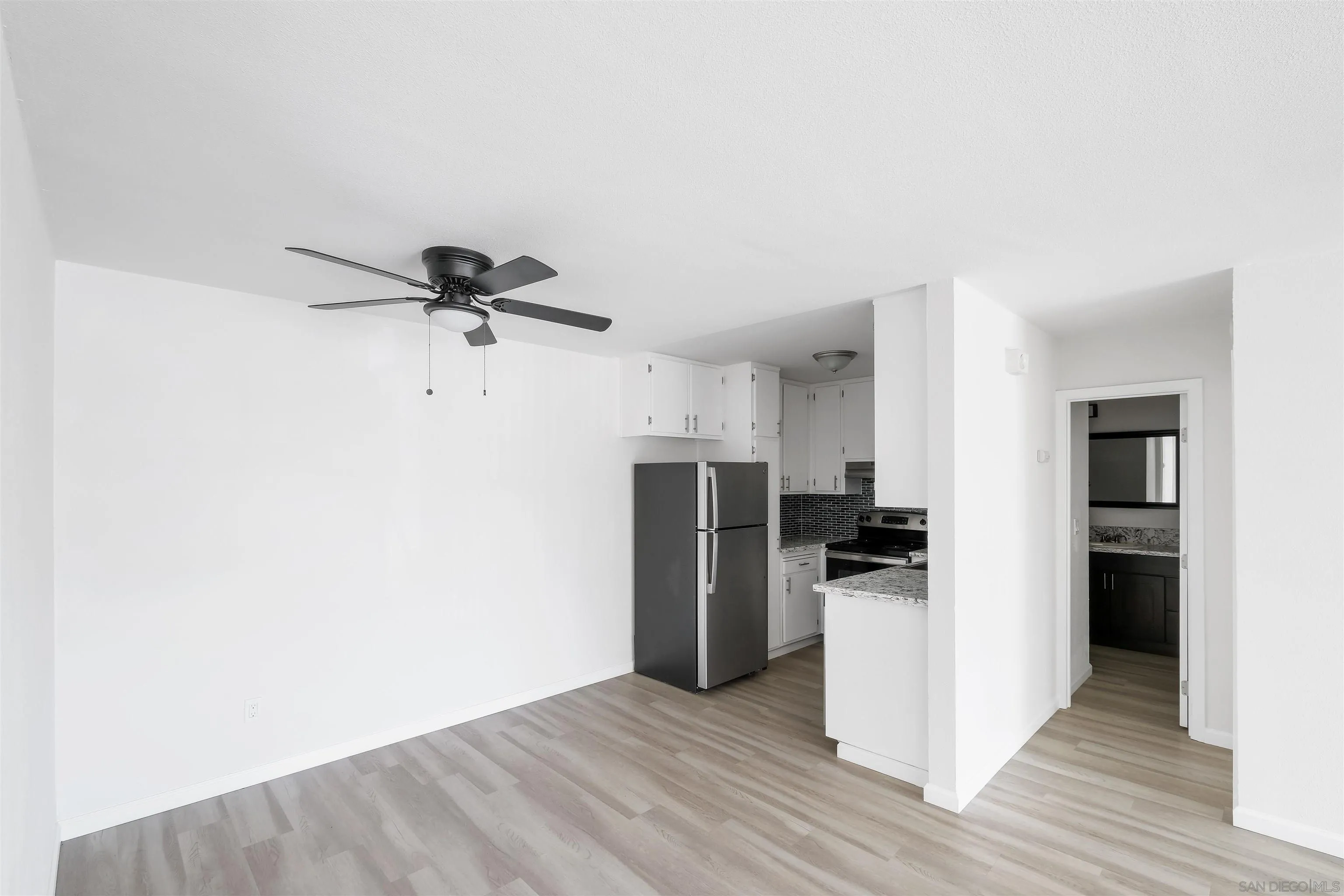 3827 Conrad Drive Spring Valley, CA 91977 - Photo 4 of 9 a view of a kitchen with a refrigerator and a stove top oven