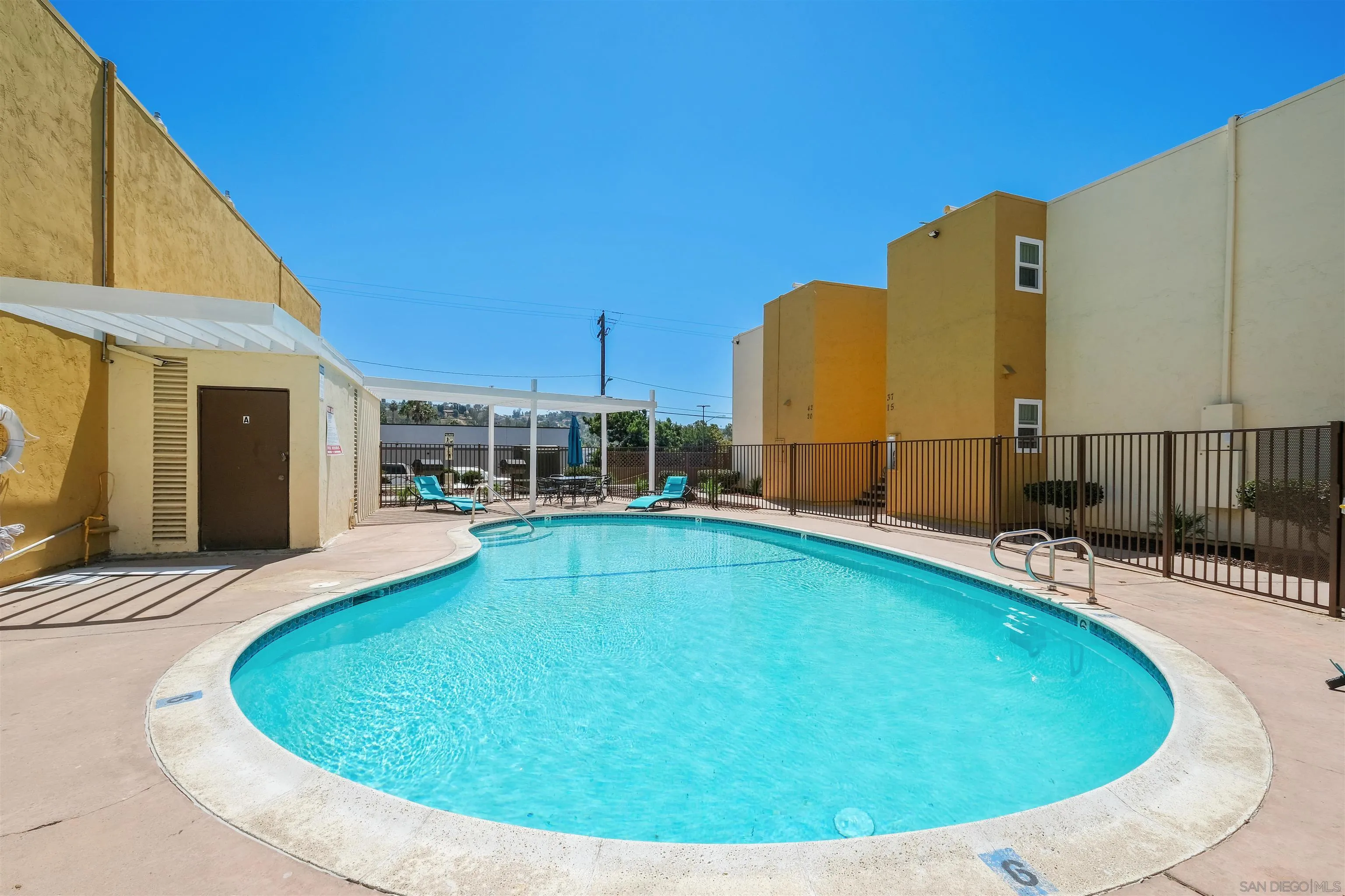 3827 Conrad Drive Spring Valley, CA 91977 - Photo 9 of 9 a view of a swimming pool with a lounge chairs