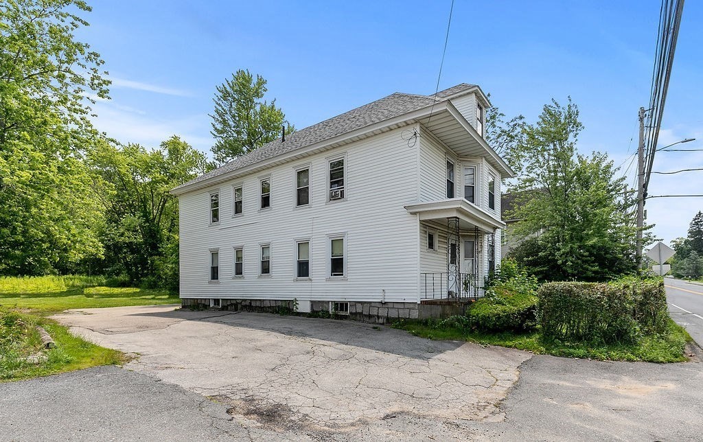 159-161 Howe Street Methuen, MA 01844 - Photo 14 of 15 a view of a house with a yard