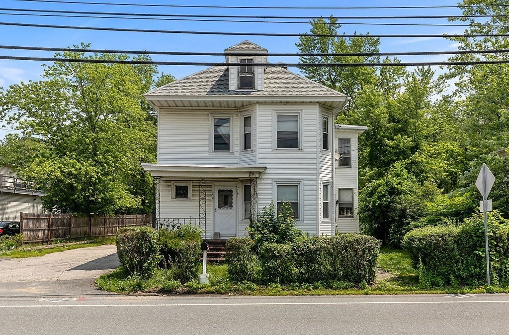 159-161 Howe Street Methuen, MA 01844 - Photo 2 of 15 a front view of a house with garden