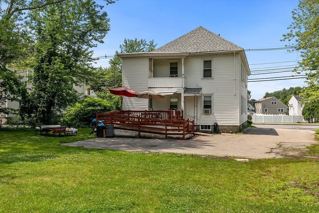 159-161 Howe Street Methuen, MA 01844 - Photo 4 of 15 a view of a house with backyard and sitting area