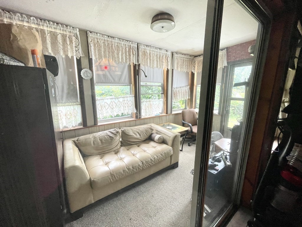 159-161 Howe Street Methuen, MA 01844 - Photo 5 of 15 a living room with furniture and a large window
