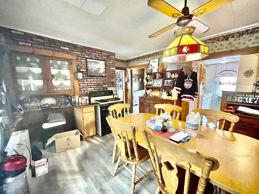 159-161 Howe Street Methuen, MA 01844 - Photo 7 of 15 a view of a dining area with furniture and chandelier