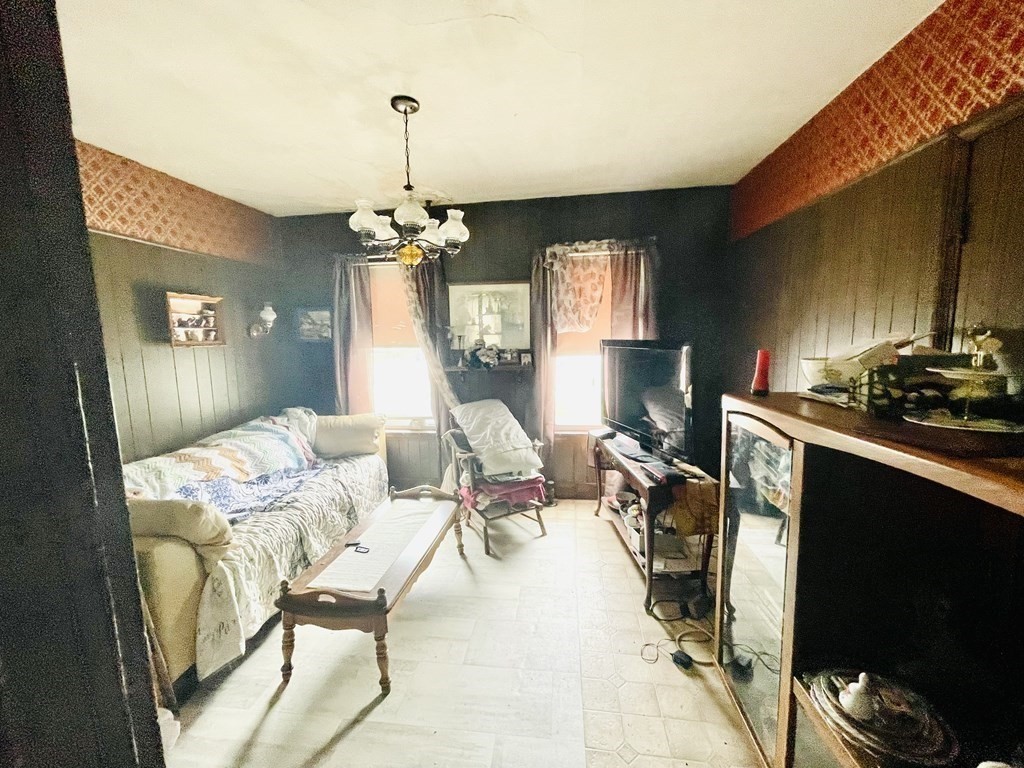 159-161 Howe Street Methuen, MA 01844 - Photo 8 of 15 a living room with furniture a window and a chandelier