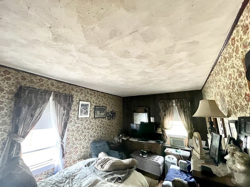 159-161 Howe Street Methuen, MA 01844 - Photo 9 of 15 a bedroom with furniture and a window