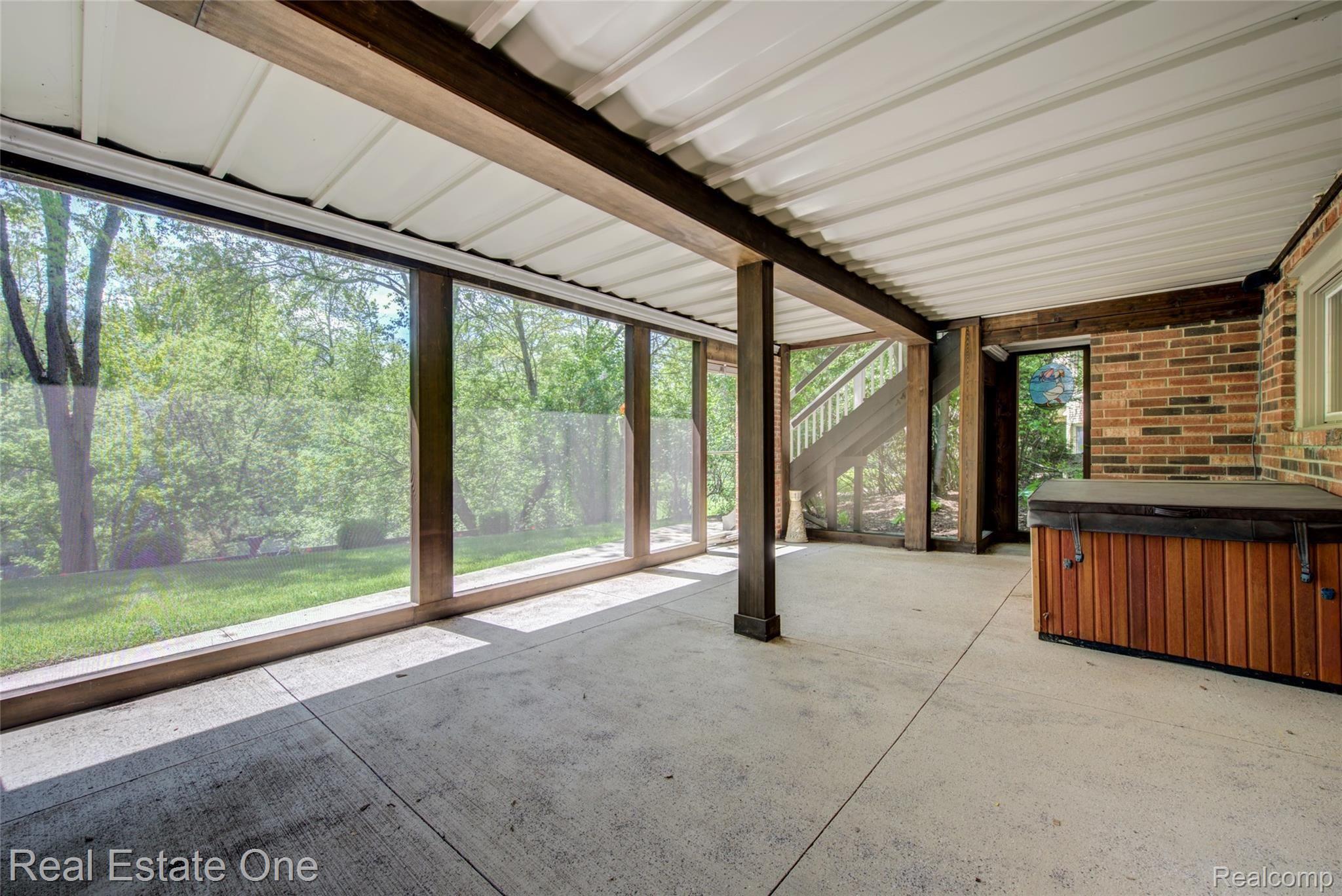3274 Quail Ridge Circle Rochester, MI 48309 - Photo 59 of 74 Screened in patio with under deck ceiling system, hot tub