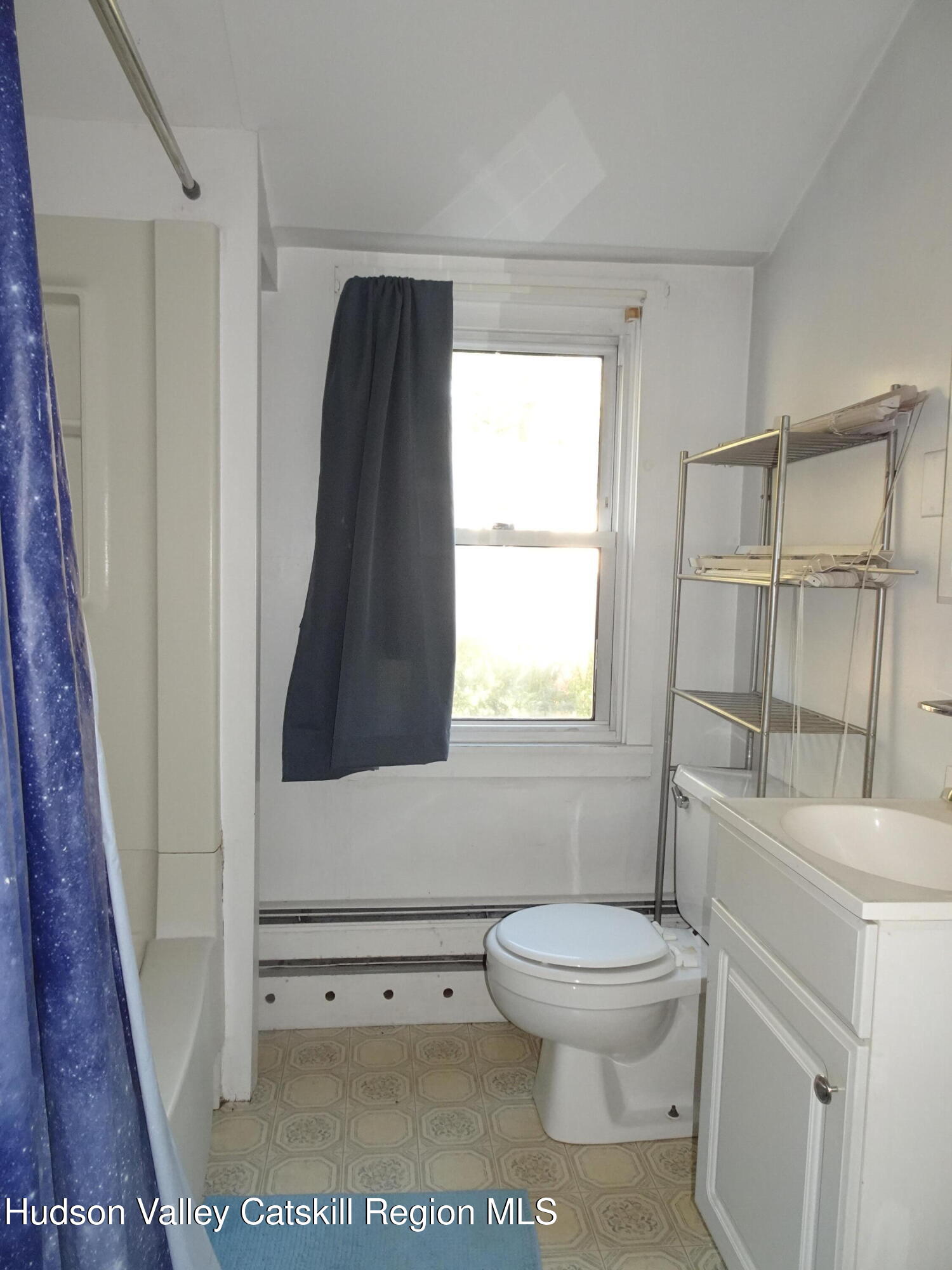 5 Old Lane, Unit MEWS A Claverack, NY 12534 - Photo 15 of 19 a bathroom with a toilet a sink and a window