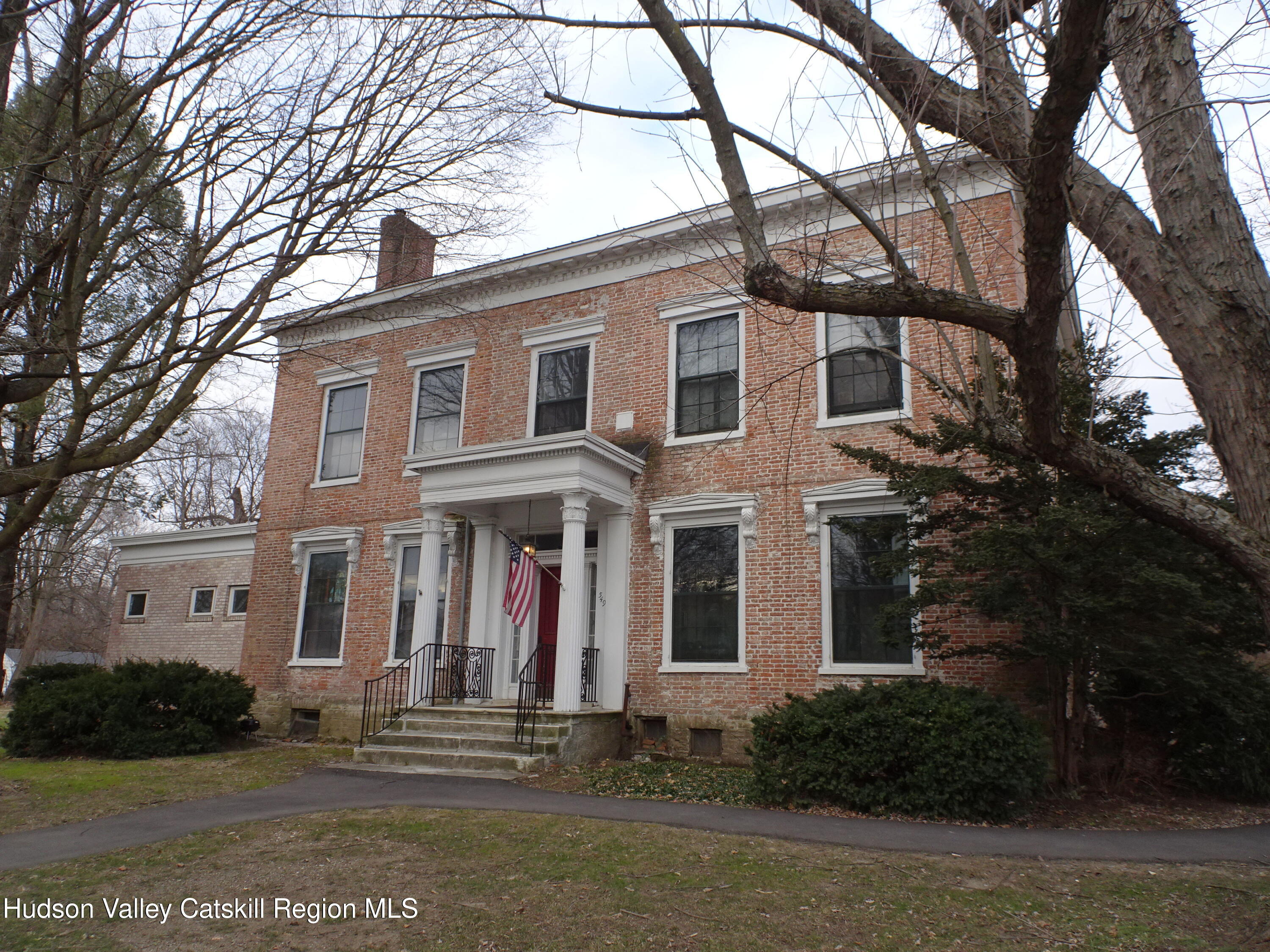 5 Old Lane, Unit MEWS A Claverack, NY 12534 - Photo 18 of 19 a front view of a house with a yard