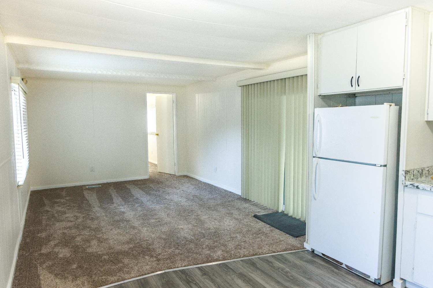 10251 Combie Road, Unit 13 Auburn, CA 95602 - Photo 11 of 16 a view of a kitchen with a refrigerator and a refrigerator