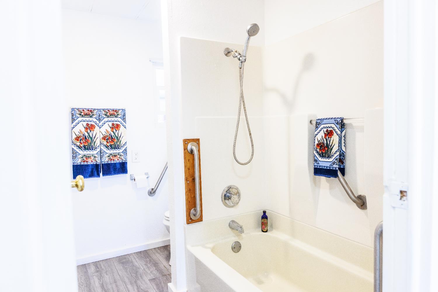10251 Combie Road, Unit 13 Auburn, CA 95602 - Photo 6 of 16 a bathroom with a bathtub and a shower
