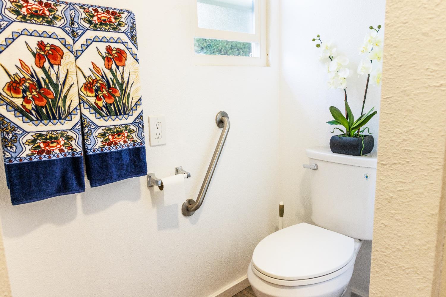 10251 Combie Road, Unit 13 Auburn, CA 95602 - Photo 7 of 16 a white toilet sitting next to a sink