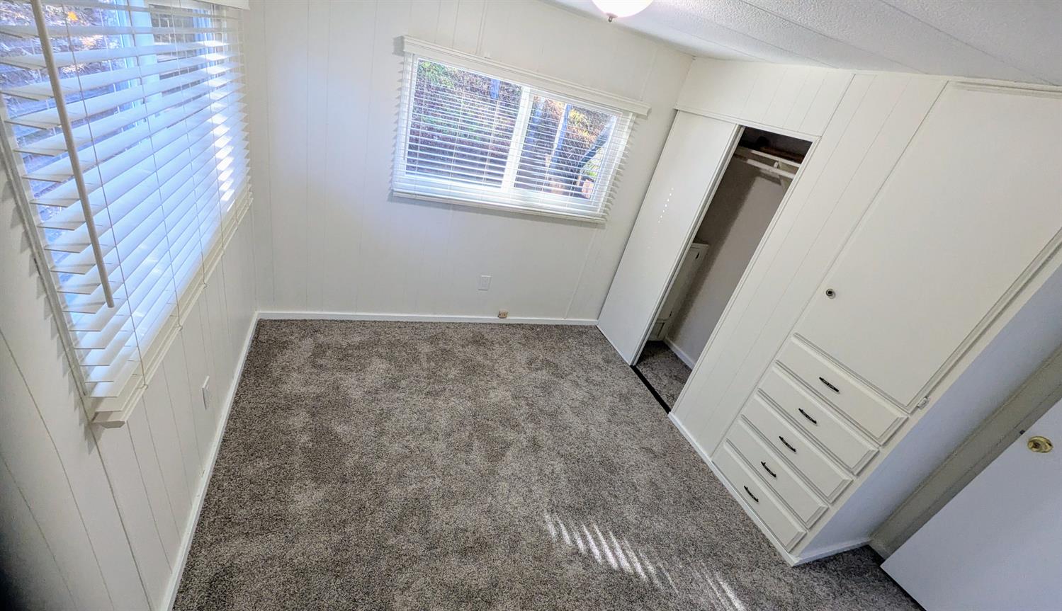 10251 Combie Road, Unit 13 Auburn, CA 95602 - Photo 10 of 16 a view of an empty room with a window