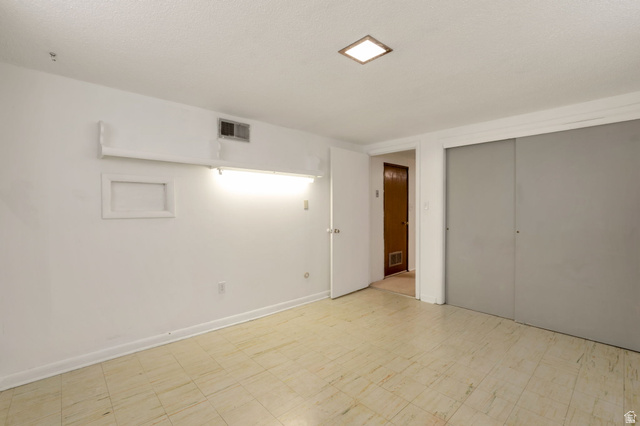 447 550 South Bountiful, UT 84010 - Photo 21 of 25 Room with light-toned flooring, featuring a recessed ceiling light and white baseboards