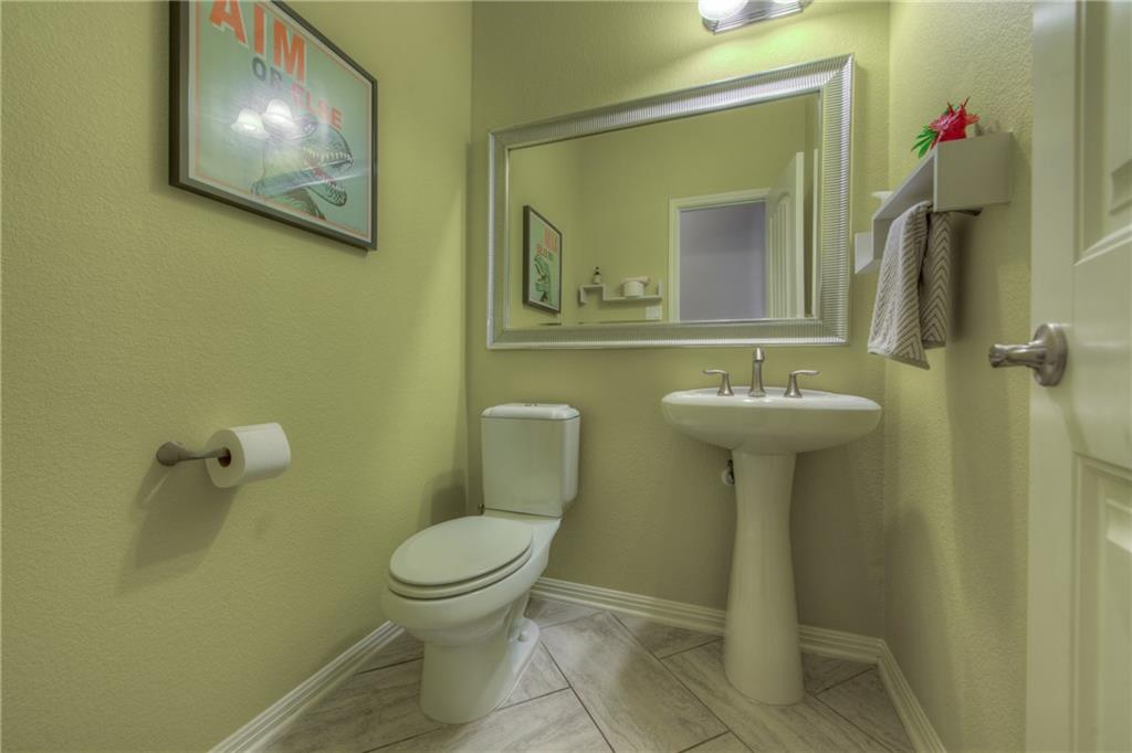 1511 Rimstone Drive Cedar Park, TX 78613 - Photo 17 of 40 a bathroom with a toilet sink and mirror