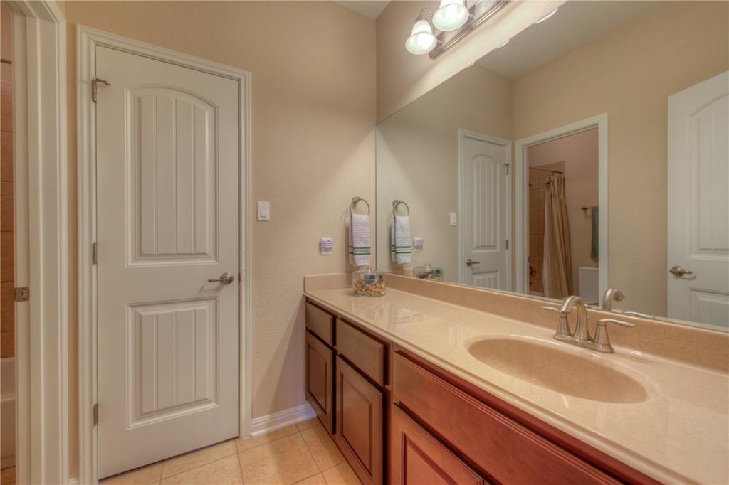 1511 Rimstone Drive Cedar Park, TX 78613 - Photo 26 of 40 a bathroom with 2 sink and a mirror