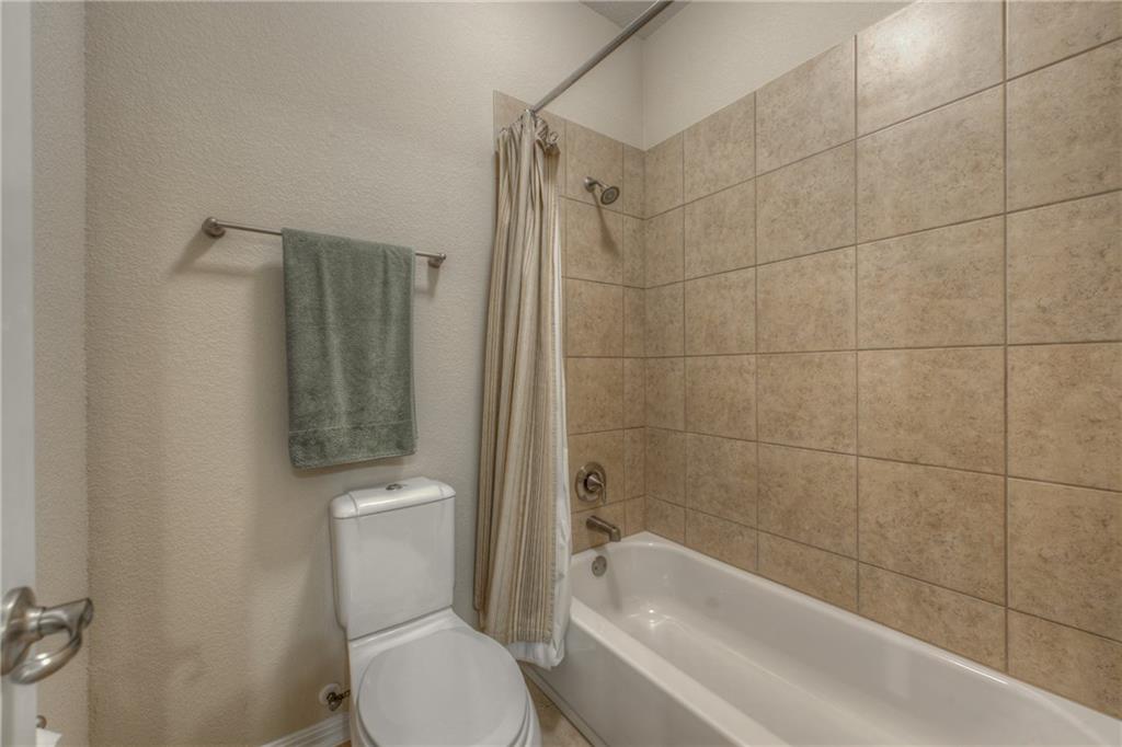 1511 Rimstone Drive Cedar Park, TX 78613 - Photo 27 of 40 a bathroom with a toilet and shower