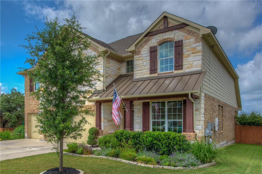 1511 Rimstone Drive Cedar Park, TX 78613 - Photo 3 of 40 a front view of a house with a yard