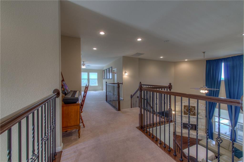 1511 Rimstone Drive Cedar Park, TX 78613 - Photo 31 of 40 a view of a hallway with a livingroom with furniture