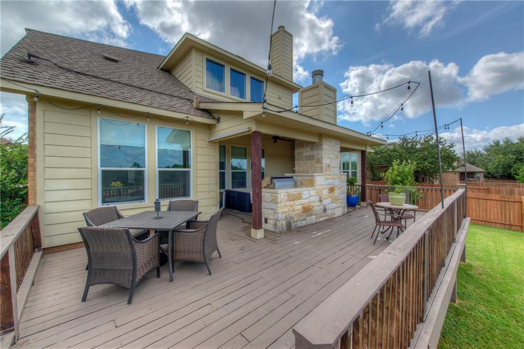 1511 Rimstone Drive Cedar Park, TX 78613 - Photo 36 of 40 a view of a patio with table and chairs and wooden floor
