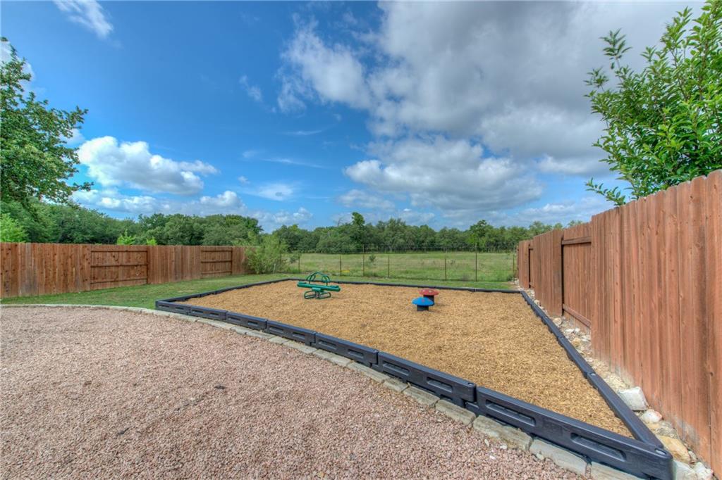 1511 Rimstone Drive Cedar Park, TX 78613 - Photo 40 of 40 a view of a backyard with wooden fence