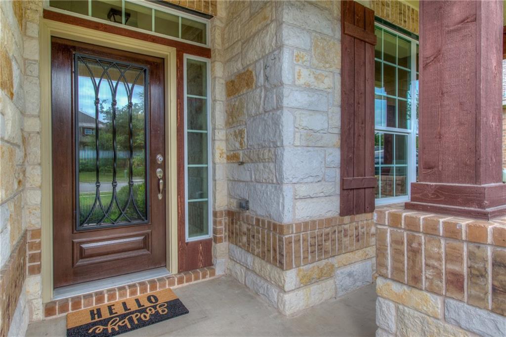 1511 Rimstone Drive Cedar Park, TX 78613 - Photo 4 of 40 a view of a brick house with a large window