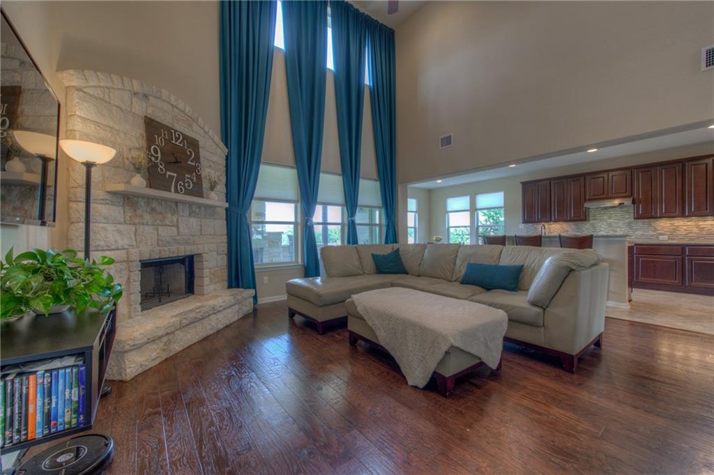 1511 Rimstone Drive Cedar Park, TX 78613 - Photo 10 of 40 a living room with furniture and a fireplace