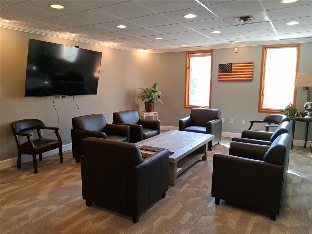 2550 Boyce Plaza Road Pittsburgh, PA 15241 - Photo 11 of 21 a living room with furniture and a flat screen tv