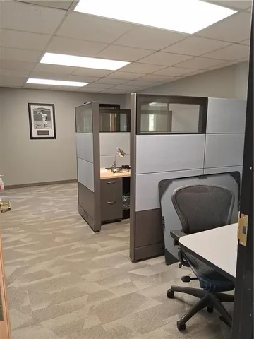a living room with furniture and a chair