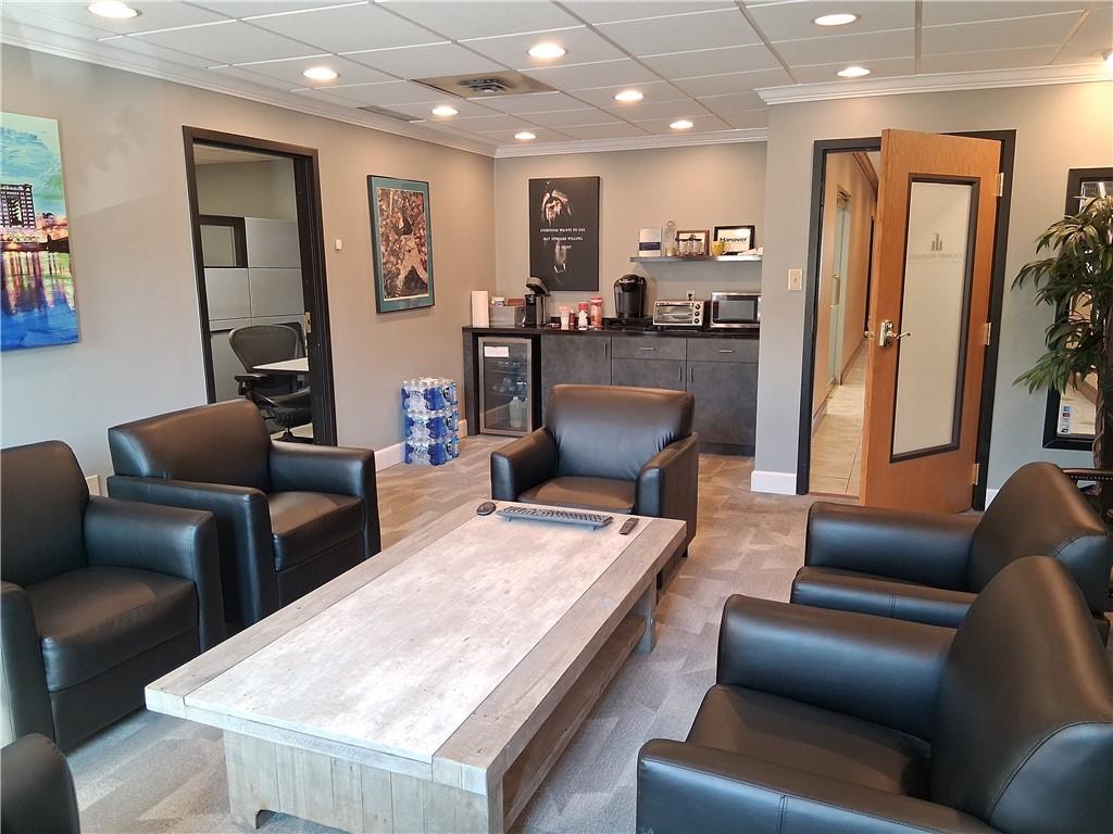 2550 Boyce Plaza Road Pittsburgh, PA 15241 - Photo 10 of 21 a living room with furniture and a dining table with kitchen view
