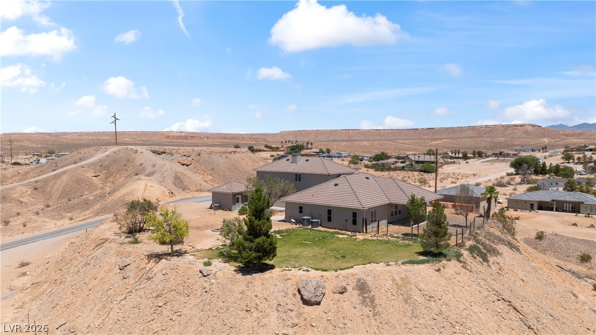 575 Gann Avenue Logandale, NV 89021 - Photo 72 of 75 Perched on a desert hill, this residence commands expansive views of the surrounding landscape.
