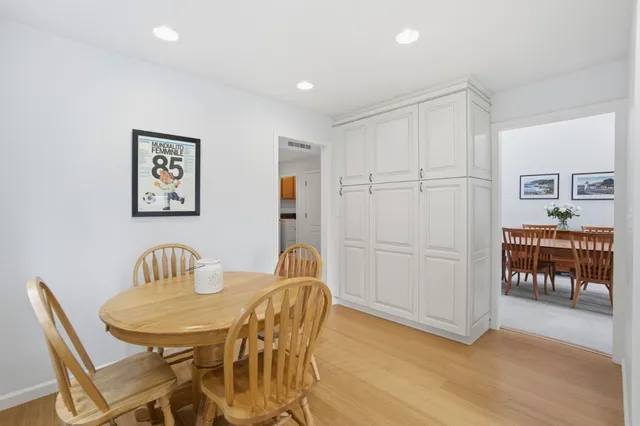 an empty room with closet and wooden floor